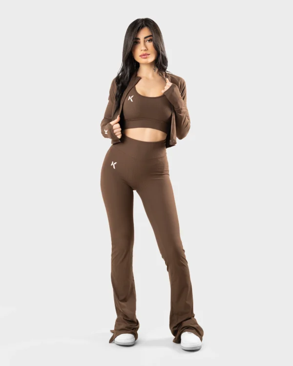 Unveil your style with the Cocoa Elegance Crisscross Set, featuring a captivating backless top with a unique crisscross tie design and matching flared leggings. This set is a statement of sophistication and fashion-forward thinking, perfect for those who dare to stand out. The rich cocoa shade complements any skin tone, making it a versatile addition to your wardrobe. Whether you're heading to a yoga class or brunch with friends, this set is sure to turn heads.